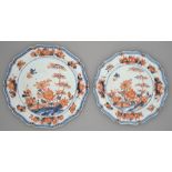 A graduated pair of Chinese Imari plates, 18th c, of shaped outline with moulded rim, painted with