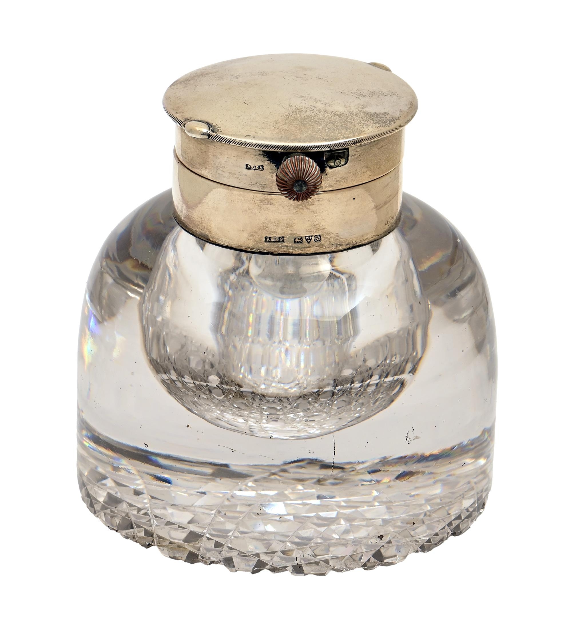 A George V silver mounted glass inkwell, the hinged lid opening to reveal a contemporary keyless