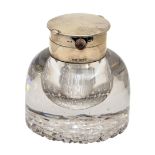 A George V silver mounted glass inkwell, the hinged lid opening to reveal a contemporary keyless