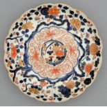 An Imari fluted dish, Edo period, 18th c, painted in underglaze blue and enamelled in red and gilt