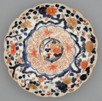An Imari fluted dish, Edo period, 18th c, painted in underglaze blue and enamelled in red and gilt