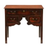 A George III oak and crossbanded lowboy, with three cockbeaded drawers to the unusually arched