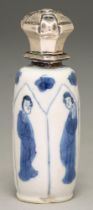 A Chinese moulded blue and white miniature vase, painted with a lady in lappet shaped panels,