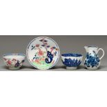 A Caughley blue and white sparrow beak jug and fluted tea bowl and a Lowestoft tea bowl and