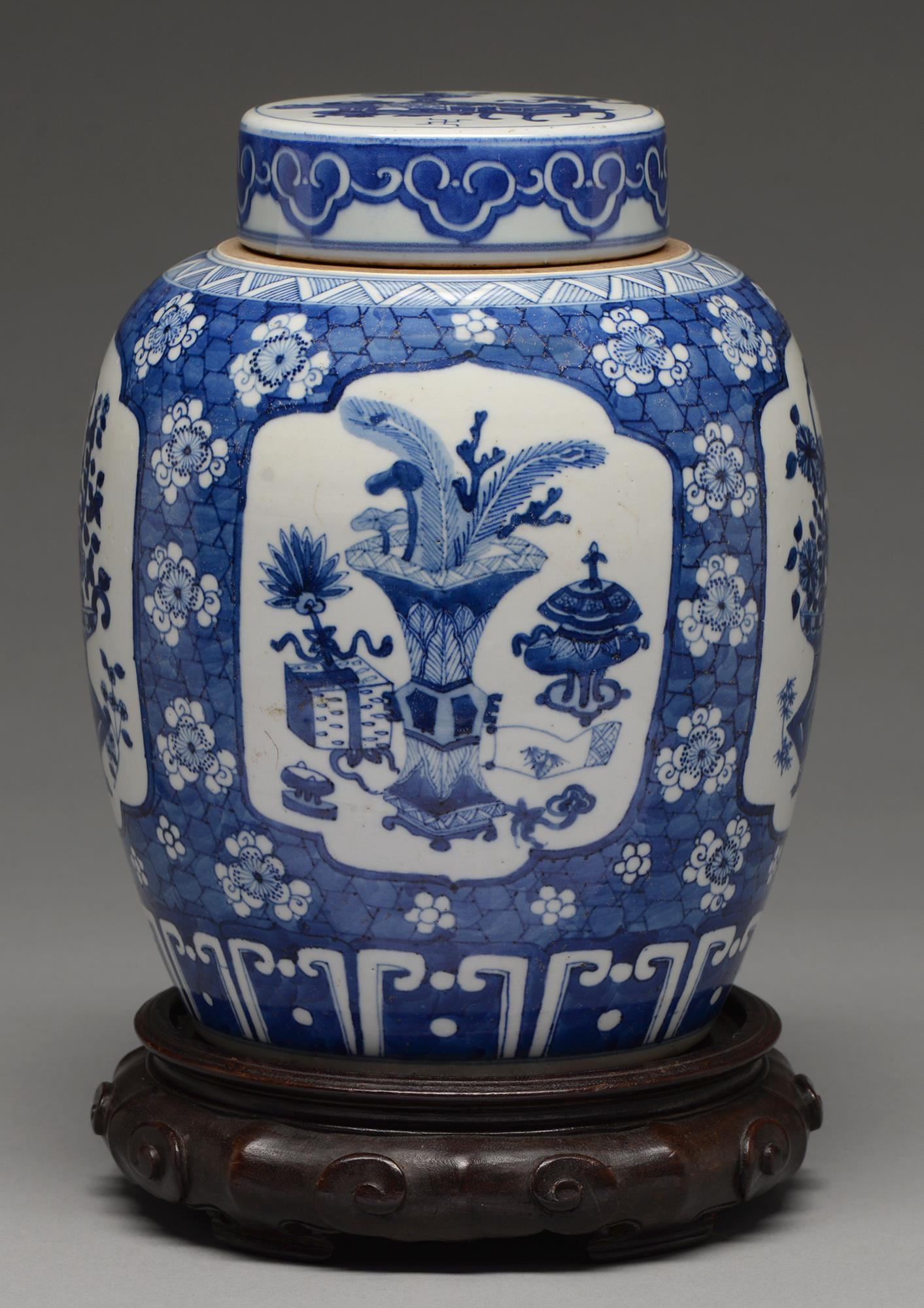 A Chinese blue and white jar and cover, late 19th c, painted with a basket of flowers or precious