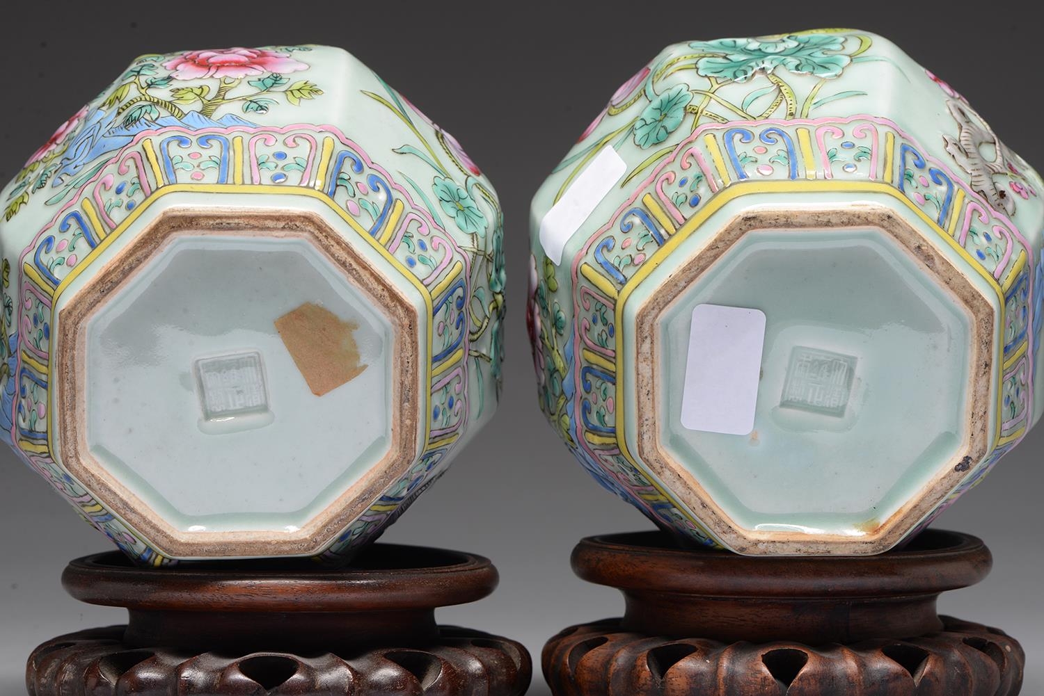 A pair of Chinese celadon ground famille rose moulded octagonal jars, 20th c, decorated with - Image 2 of 2