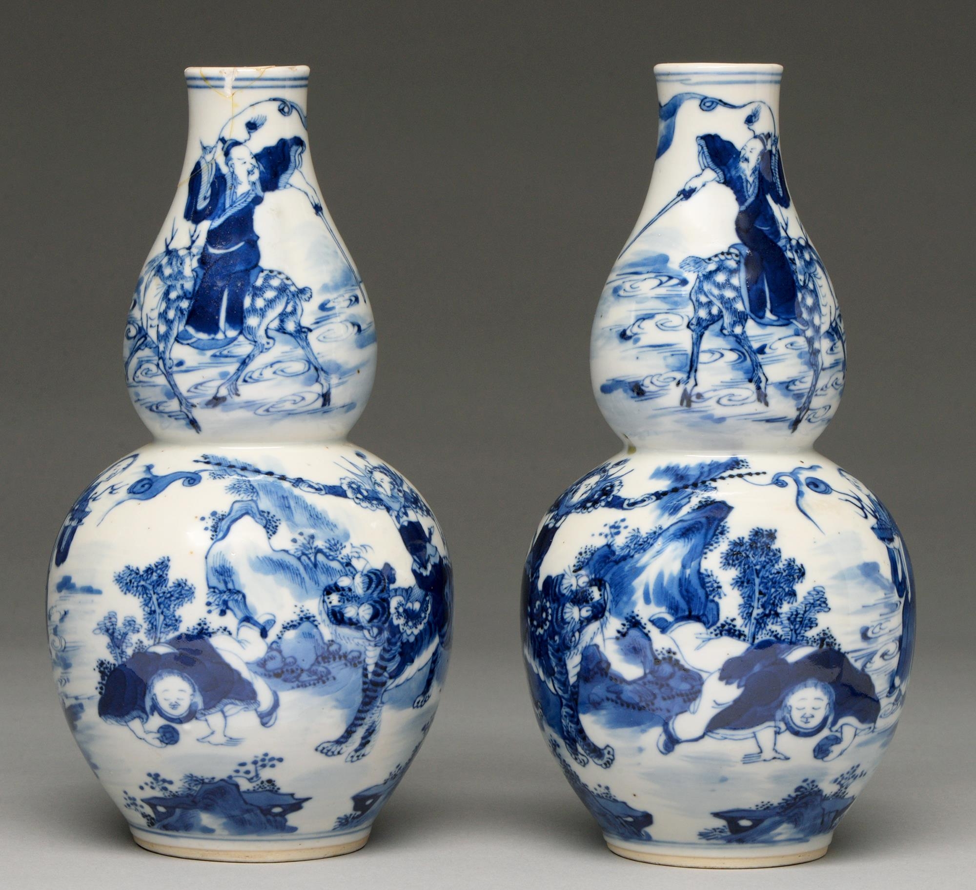 A pair of Chinese blue and white double gourd vases, 19th c, painted with figures including Zhao