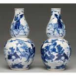 A pair of Chinese blue and white double gourd vases, 19th c, painted with figures including Zhao