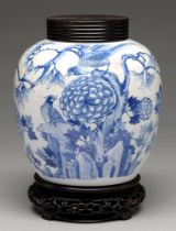 A Chinese blue and white jar, 19th c or later, painted with birds in branches and peonies, 21cm h