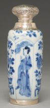 A Chinese moulded blue and white vase, 18th c, painted on slightly raised lappet shaped panels