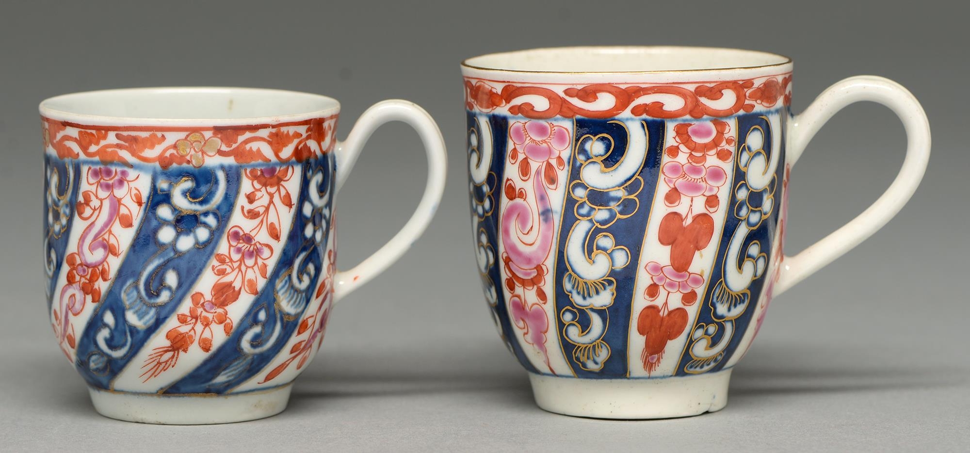 Two Worcester coffee cups, c1760 and c1770-1790, painted in underglaze blue and enamelled and gilt