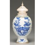 A Chinese blue and white vase, lobed ovoid on flared foot, painted with flowers growing from