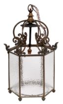 An hexagonal brass hall lantern, early 20th c, in George III style, with six pairs of looped C-