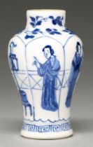 A Chinese moulded blue and white miniature baluster vase, 18th c, painted with a young woman