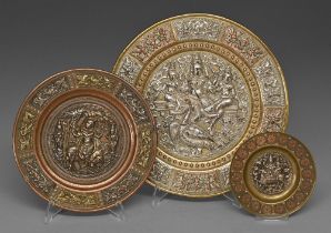 Three Indian ornamental brass dishes, 19th c, with applied silver and cast and chased brass