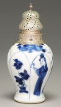 A Chinese moulded blue and white miniature vase, 18th c, painted with a woman holding a flower