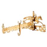 An English brass chimney crane or jack rack, first half 19th c, the mounting plate in the form of