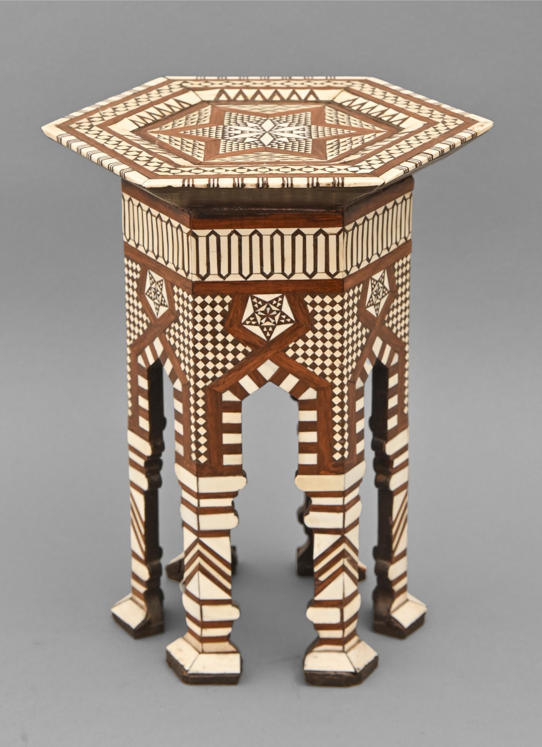 A Middle Eastern ivory-inlaid miniature hexagonal table, Egypt or Syria, late 19th c, with geometric