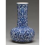 A Chinese blue and white bottle shaped vase, 20th c, painted in Ming style with lotus meander,