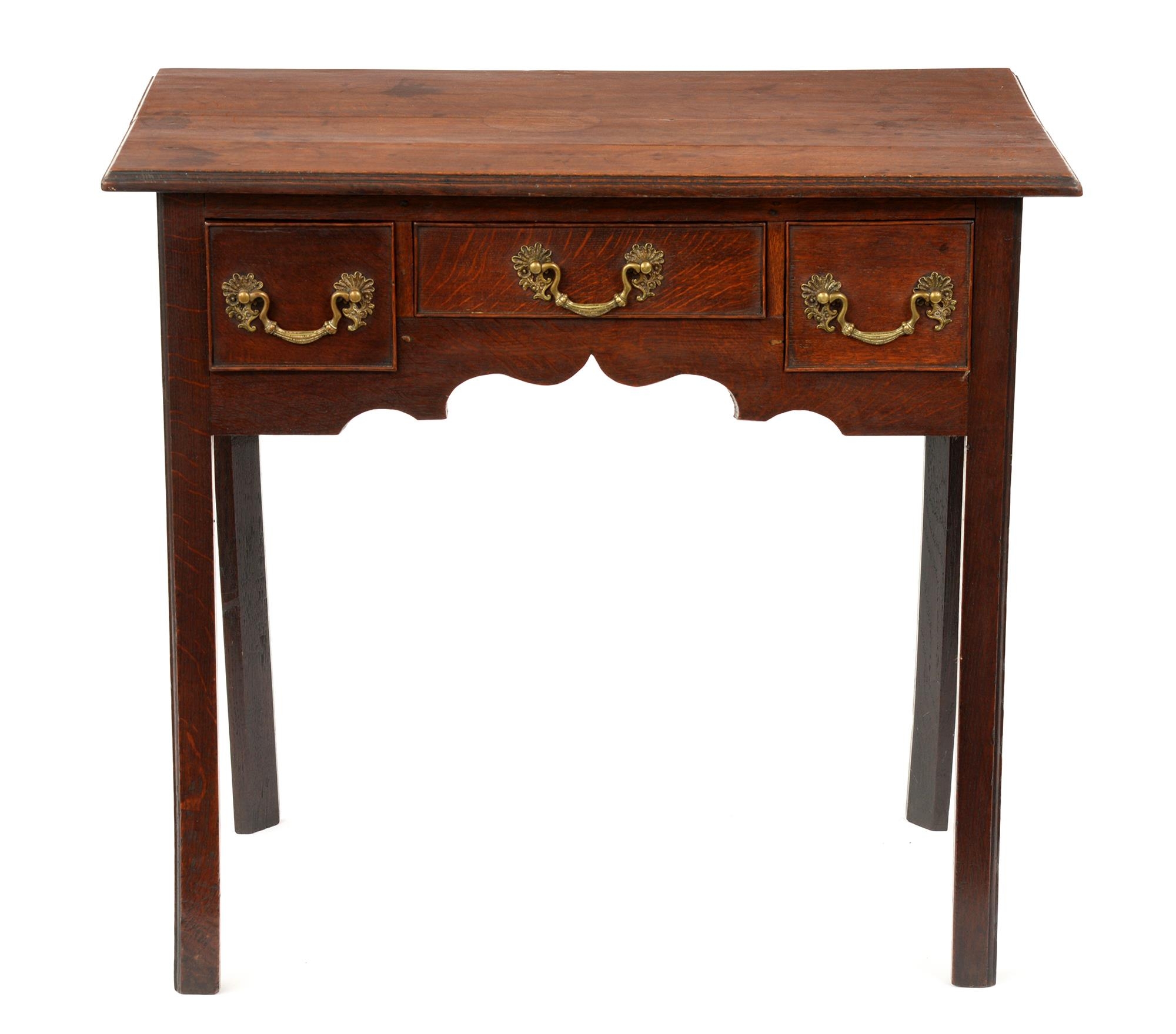 A George III oak lowboy, fitted three cockbeaded drawers to the ogee arched kneehole, on chamfered