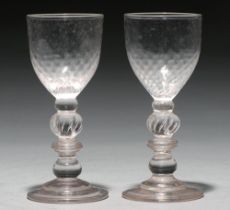 A pair of glass goblets, 19th c,   on multi knopped stem with tears and stepped foot, 16cm h