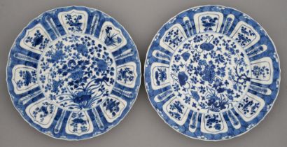 Two Chinese blue and white dishes, Kangxi period, painted with lotus or flowers, the border of lotus