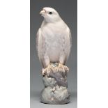 A Royal Copenhagen porcelain model of an eagle, 20th c, perched on a rocky outcrop with oak leaves