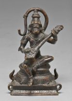 An Indian bronze sculpture of Hanuman, playing the guitar, 15cm h Complete and intact, slight wear