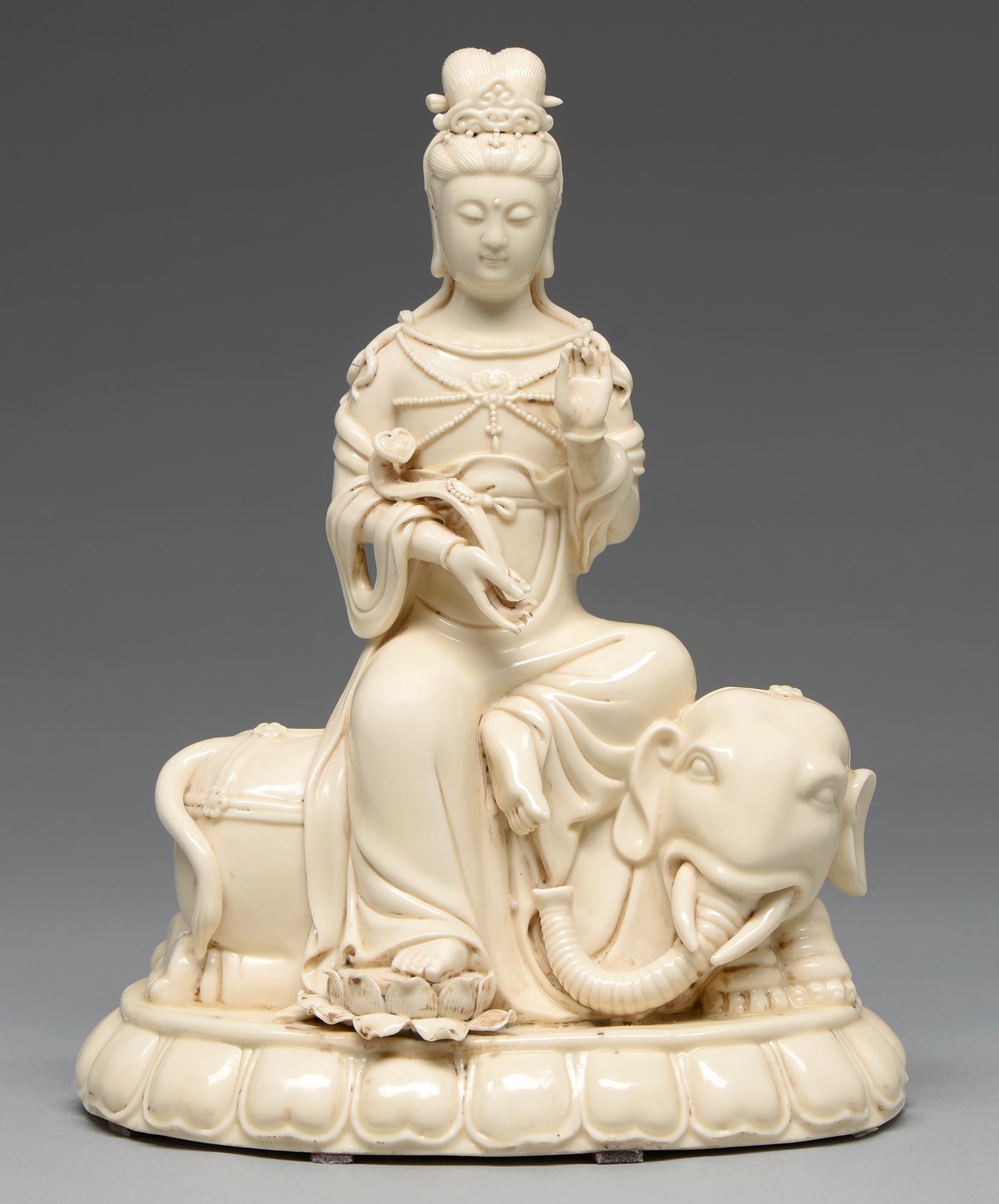 A Chinese blanc de chine figure of Guanyin on an elephant, 20th c, 32cm h The figure's fingers