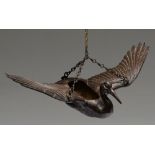 A Japanese bronze hanging sculpture of a flying crane, for flower arrangement, Meiji period, 33.