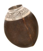 A silver mounted coconut mate pot, Mexican/Latin American, 19th c, the shoulder chased with