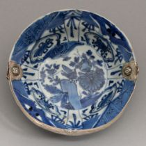 A Chinese Kraak porcelain bowl, klapmuts, c1610, painted with a cricket and flowers, adapted as a