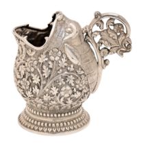 A South East Asian cast silver condiment pot in the form of a fish, late 19th c, decorated with