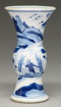 A Chinese blue and white beaker vase, 19th c, painted with a fisherman in a landscape, 11.5cm h,