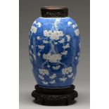 A Chinese blue and white jar, late 19th / early 20th c, painted with prunus on a cracked ice ground,