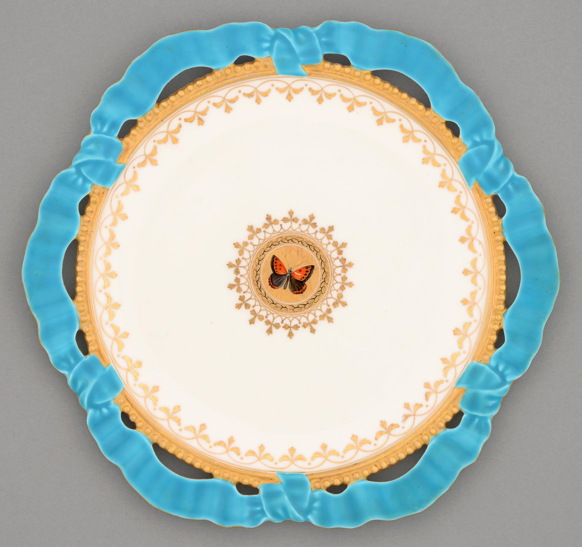 A Brown-Westhead, Moore & Co ribbon bordered dessert plate, c1870, enamelled and gilt to the