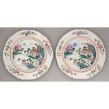 A pair of Chinese famille rose plates, c1770, enamelled with a river scene in gilt spearhead cavetto