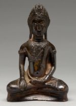 A bronze figure of Buddha, 19th c or earlier, on plain concave base, 20.5cm h Complete and