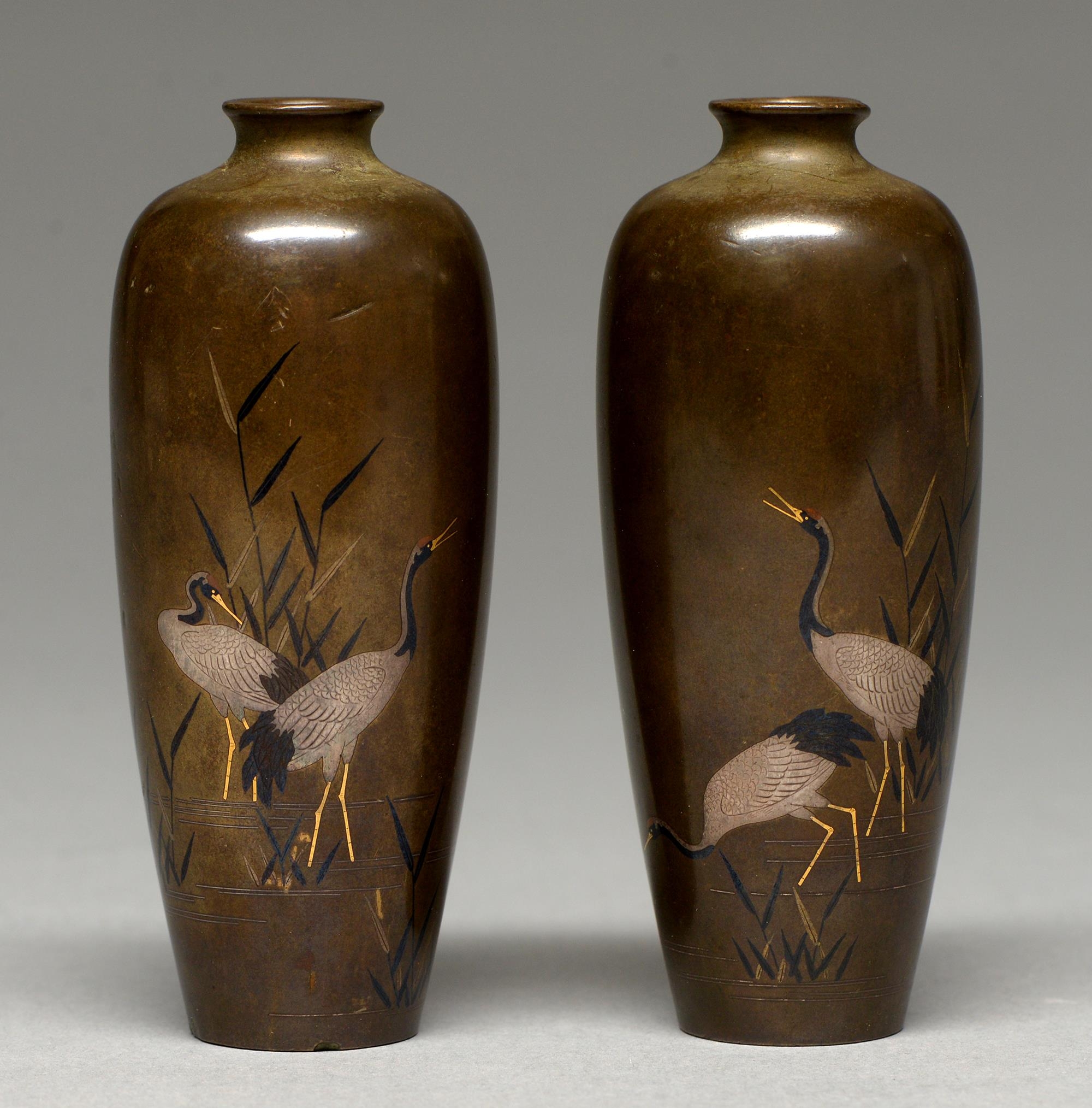A pair of Japanese inlaid bronze vases, Meiji period, with cranes and bamboo, 11.5cm h, unsigned One