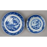 Two graduated Chinese blue and white plates, 18th c, painted with dragon and carp rising from