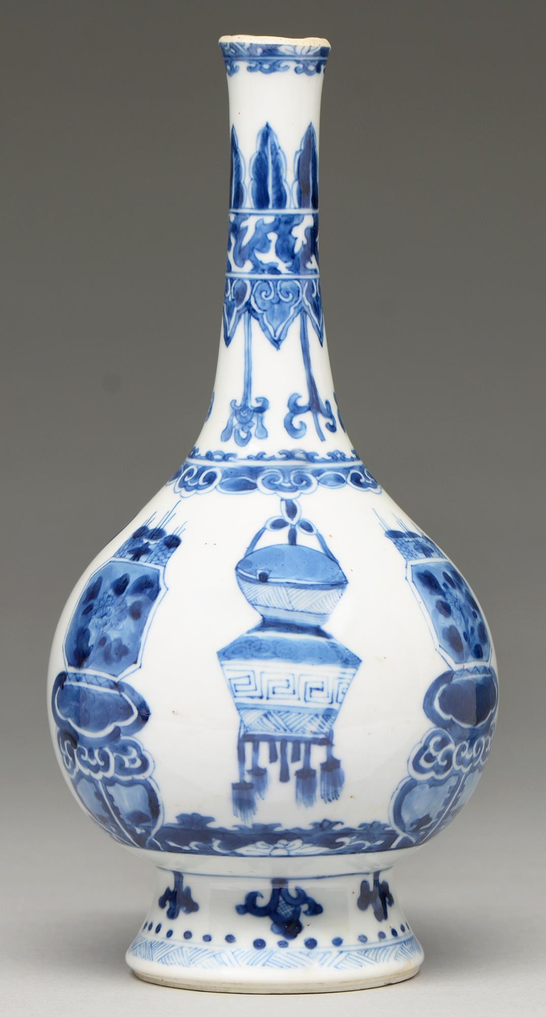 A Chinese blue and white vase, 19th c, in Kangxi style, painted with dragons and cords and hanging