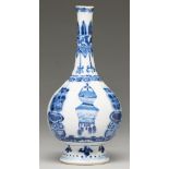 A Chinese blue and white vase, 19th c, in Kangxi style, painted with dragons and cords and hanging