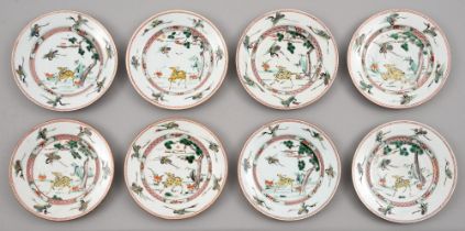 Eight Chinese famille verte 'Deer and Crane' plates, Kangxi period, enamelled with a yellow deer