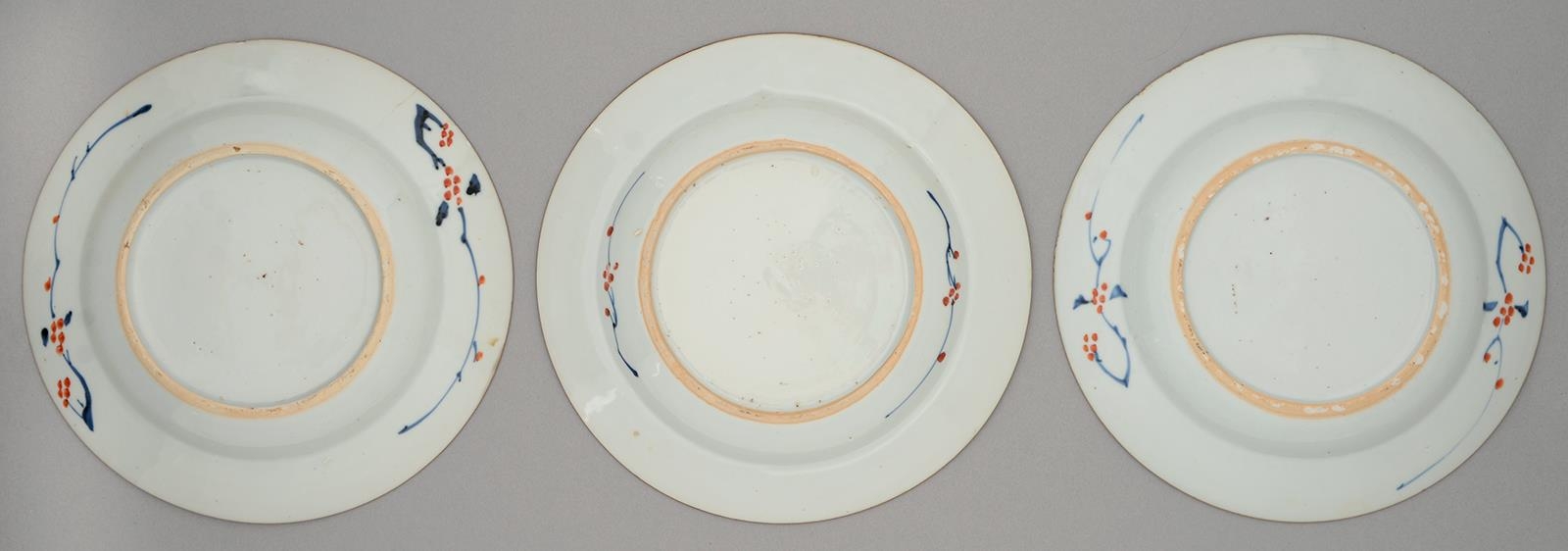 Three Chinese Imari plates, 18th c, painted with a blossoming tree and fence in panelled diaper - Image 2 of 2