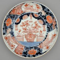 An Imari dish, Edo period, 19th c, painted in underglaze blue and enamelled in red and gilt with