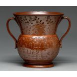 A Derbyshire saltglazed brown stoneware loving cup, Chesterfield, dated 1816, incised JAMES AND