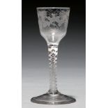 A wine glass, c1770, the ogee bowl engraved with bird and grapevines on double series opaque twist