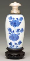 A Chinese blue and white miniature vase, 18th c, painted with two reserves of a flowering plant,