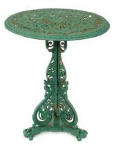 Garden furniture. A Victorian cast iron table, with pierced top and three scrolling brackets, on