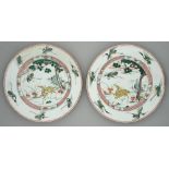 Two Chinese famille verte dishes, Kangxi period, painted with a yellow deer, phoenix and sacred